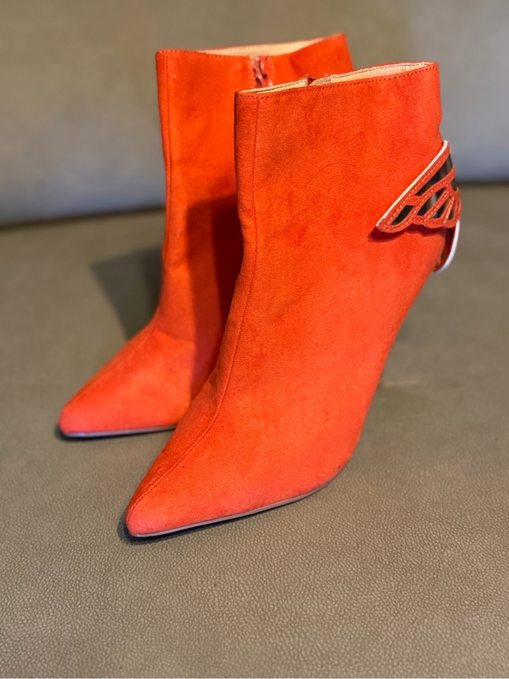 Liliana Red Suede Pointed-Toe Ankle Boots with Wing Accent